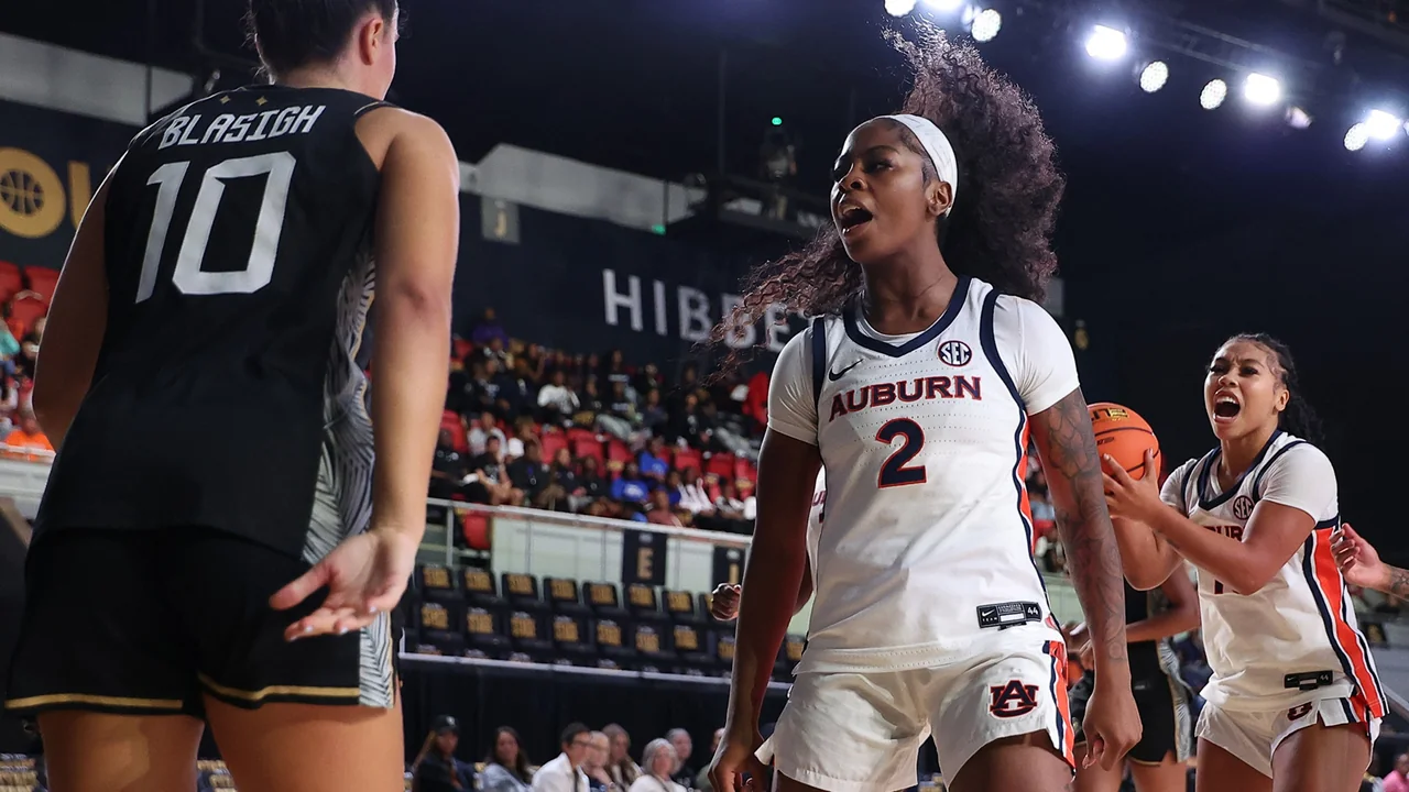 Auburn Tigers women's basketball: player holding the ball while facing a defender
