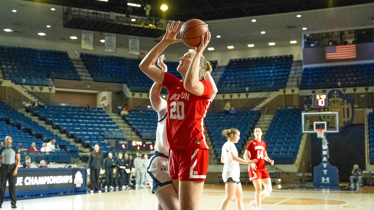 Boston University Terriers women's basketball: player taking a jump shot during an away game