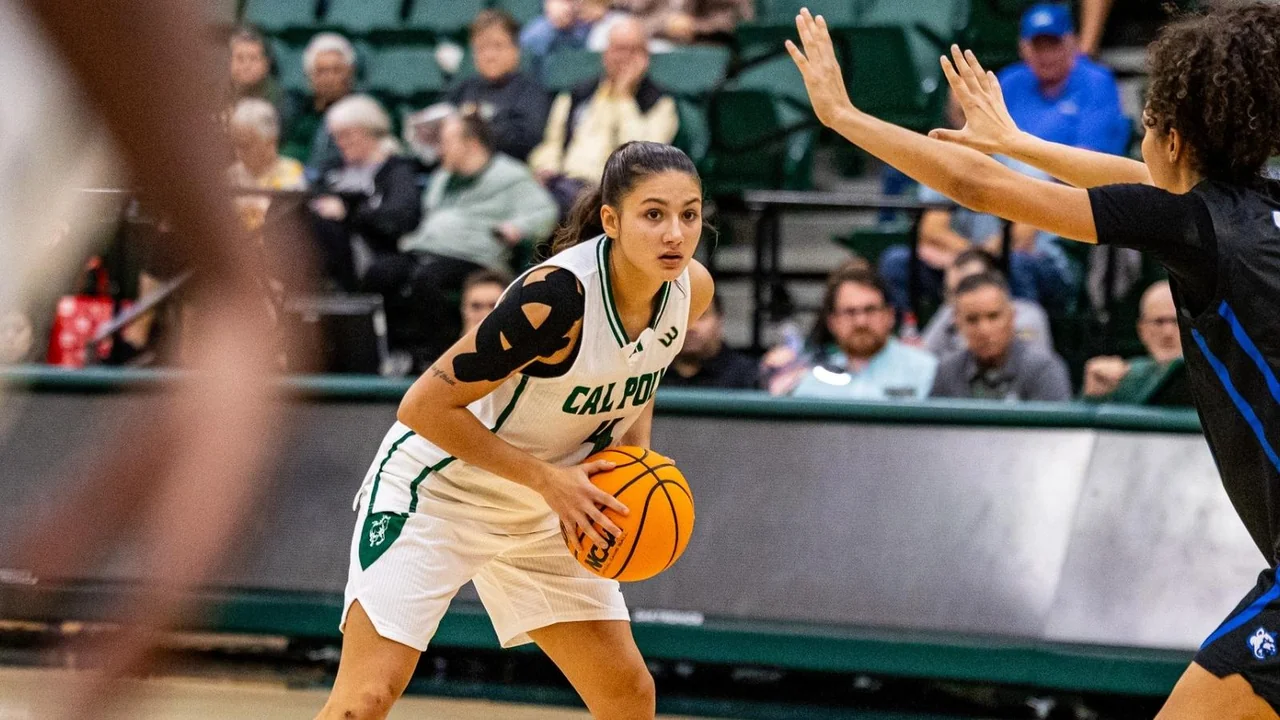 Cal Poly Mustangs women's basketball: player advancing up the court with the basketball