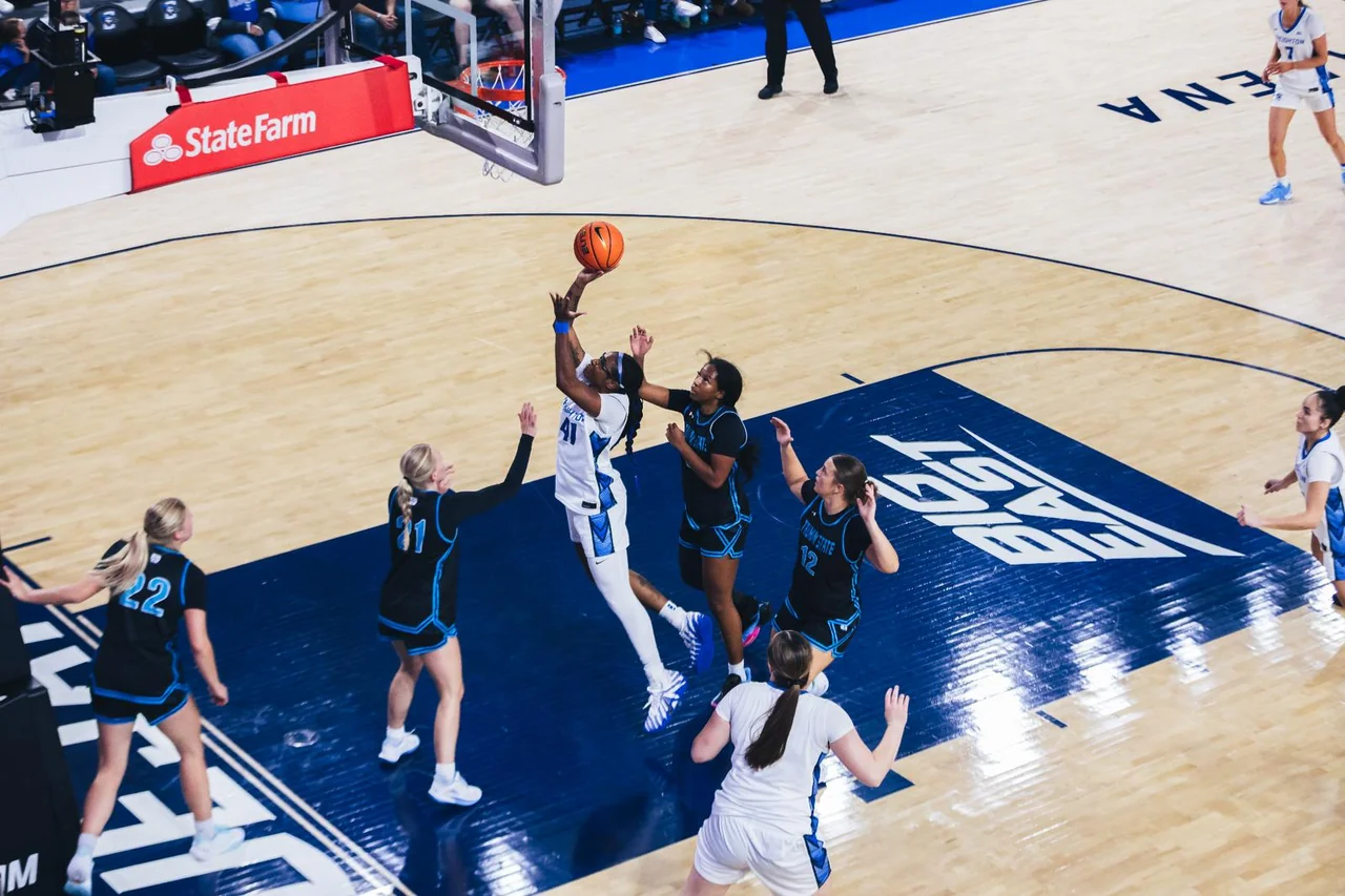 Creighton Bluejays women's basketball: players forming a circle before a home game