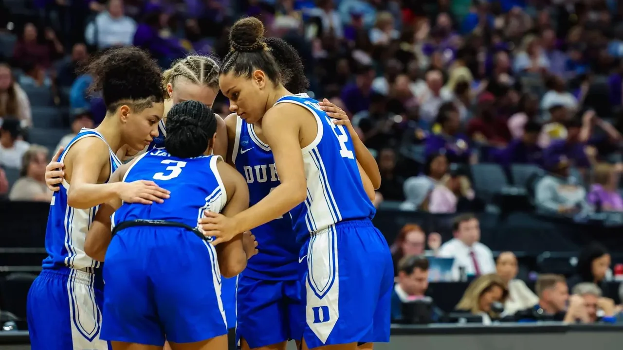 Duke Blue Devils women's basketball: players embracing in a huddle during a game