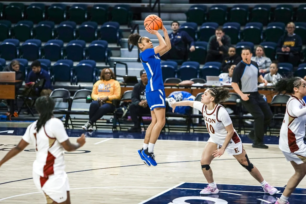Hampton Lady Pirates women's basketball: player shooting over a defender near the basket