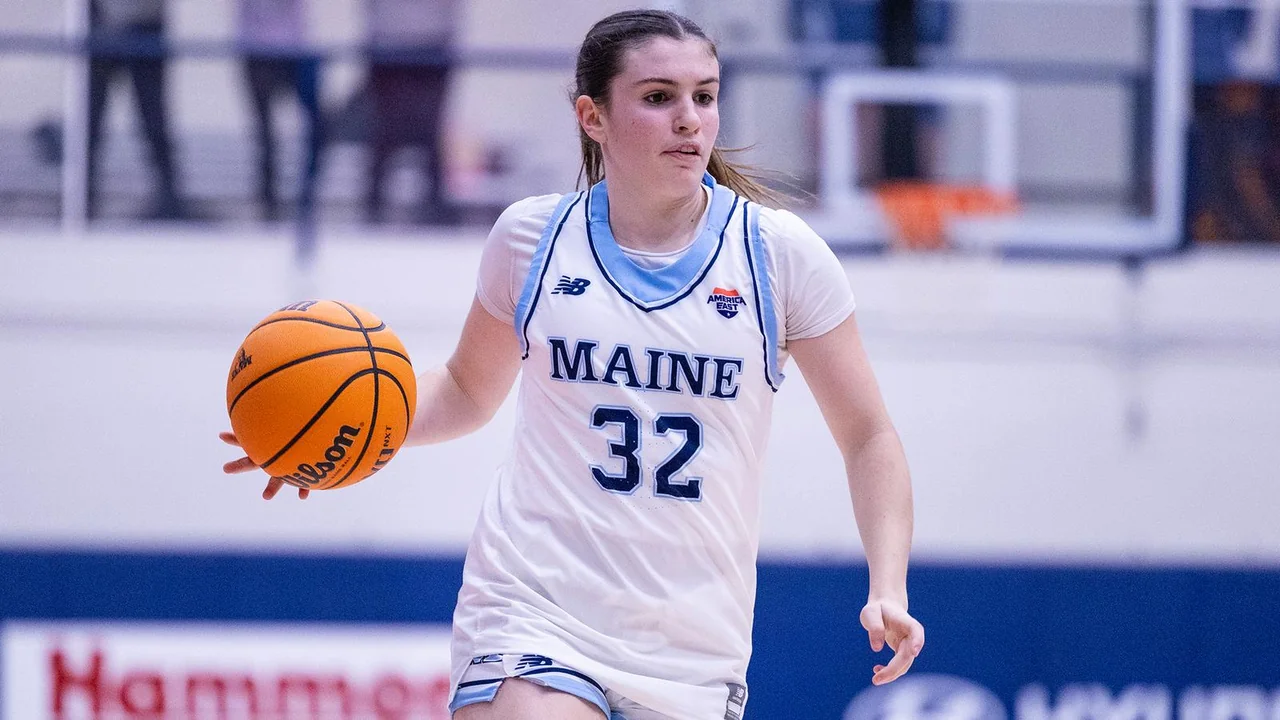 Maine Black Bears women's basketball: player advancing with the basketball during a game