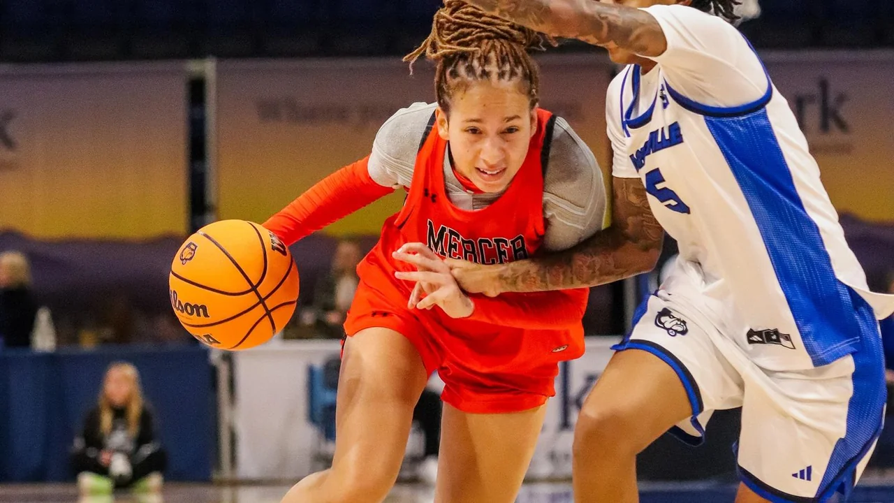 Mercer Bears women's basketball: player dribbling while an opponent guards closely