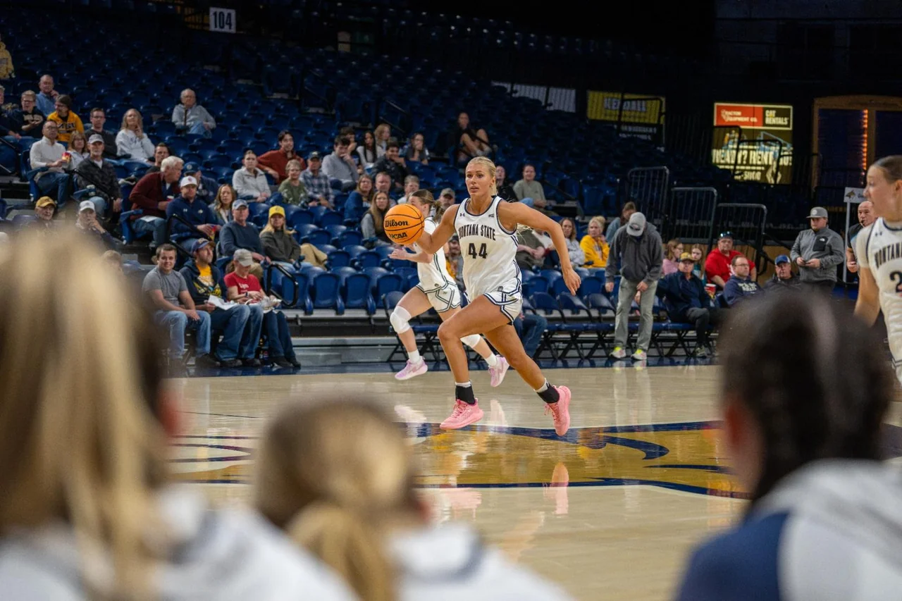 Montana State Bobcats women's basketball: player handling the ball while opponents defend
