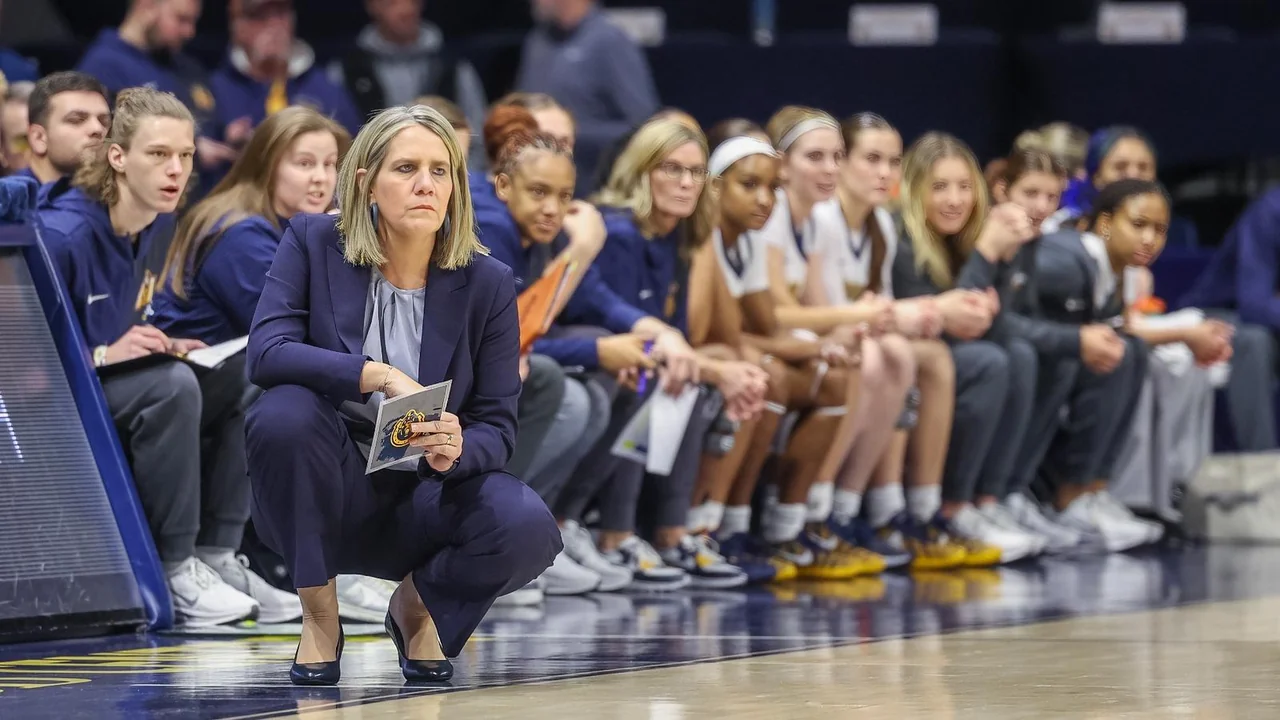 Murray State Racers women's basketball: coach and players watching from the team bench
