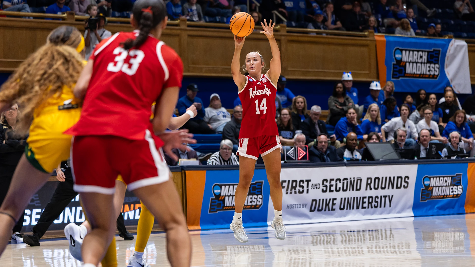 Nebraska Cornhuskers guard shooting a jump shot during an NCAA Tournament game hosted by Duke University