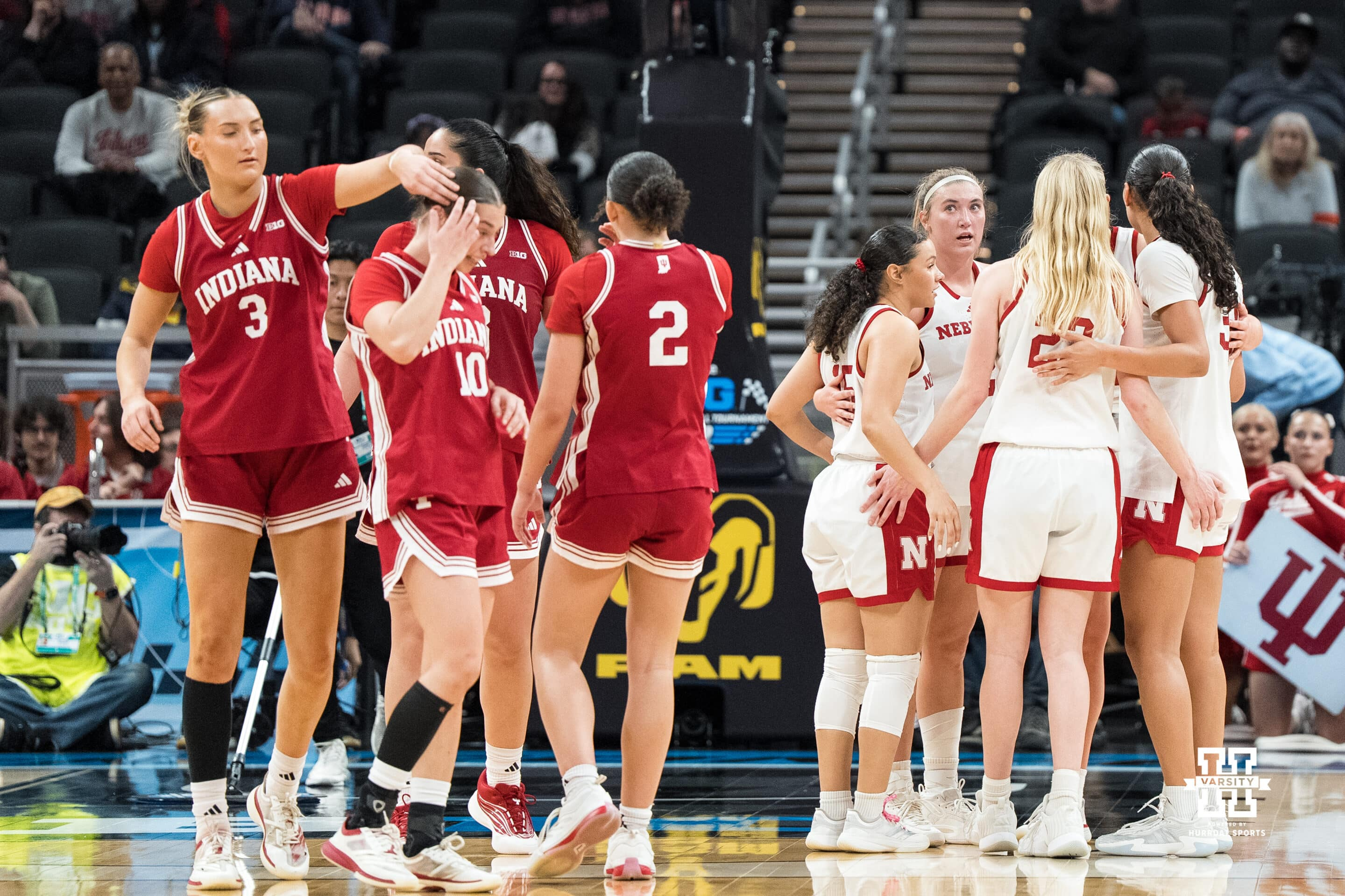 Nebraska Cornhuskers players huddled together after a Big Ten Tournament game against Indiana