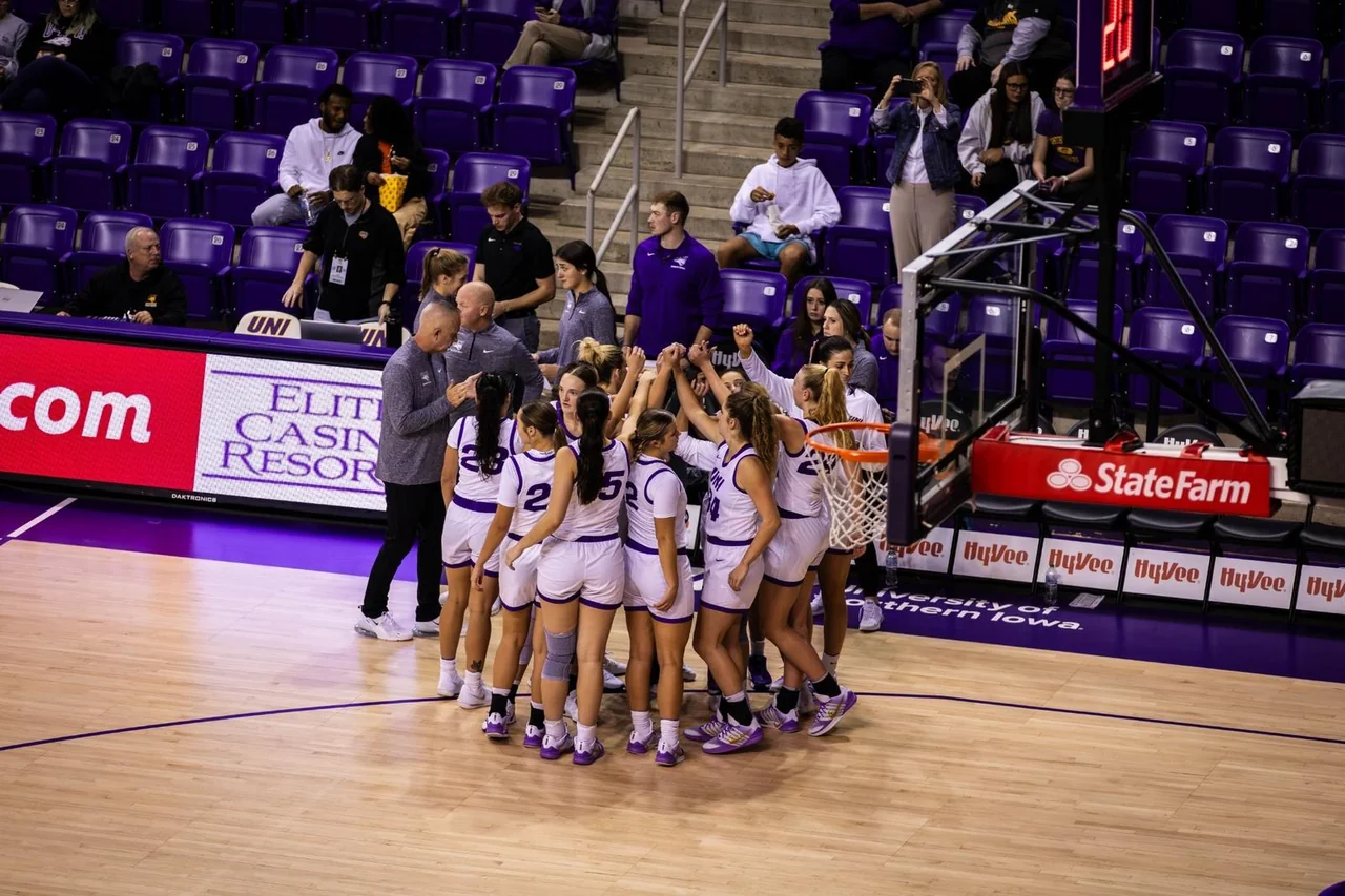 Northern Iowa Panthers women's basketball: players gathering together on the home basketball court