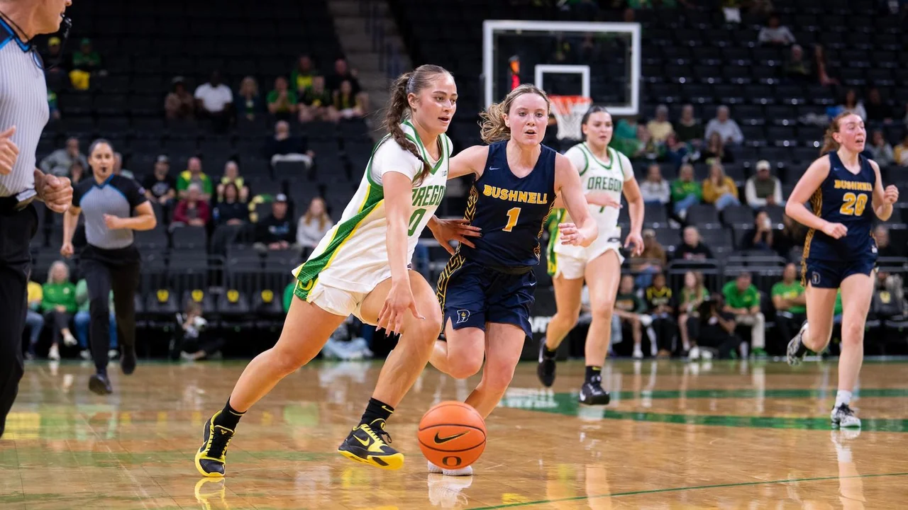 Oregon Ducks women's basketball: player dribbling past a defender during a game