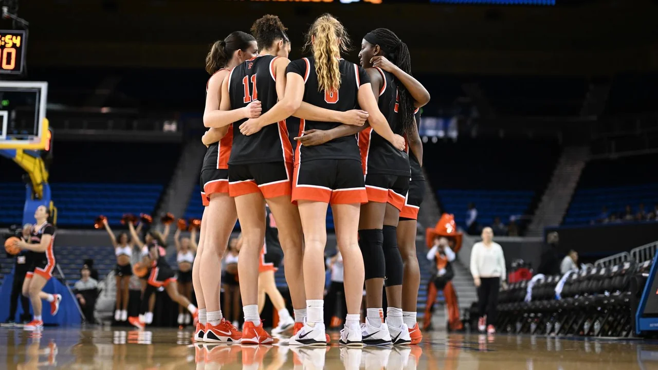 Princeton Tigers women's basketball: players gathering together on the basketball court