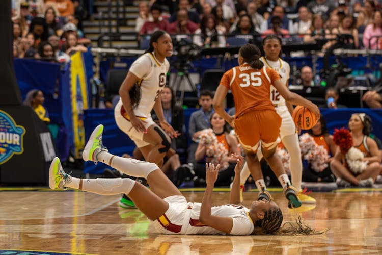 South Carolina and Texas players scrambling for a loose ball during a tournament game