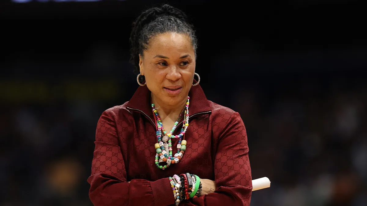 South Carolina head coach Dawn Staley watching from the sideline during a game