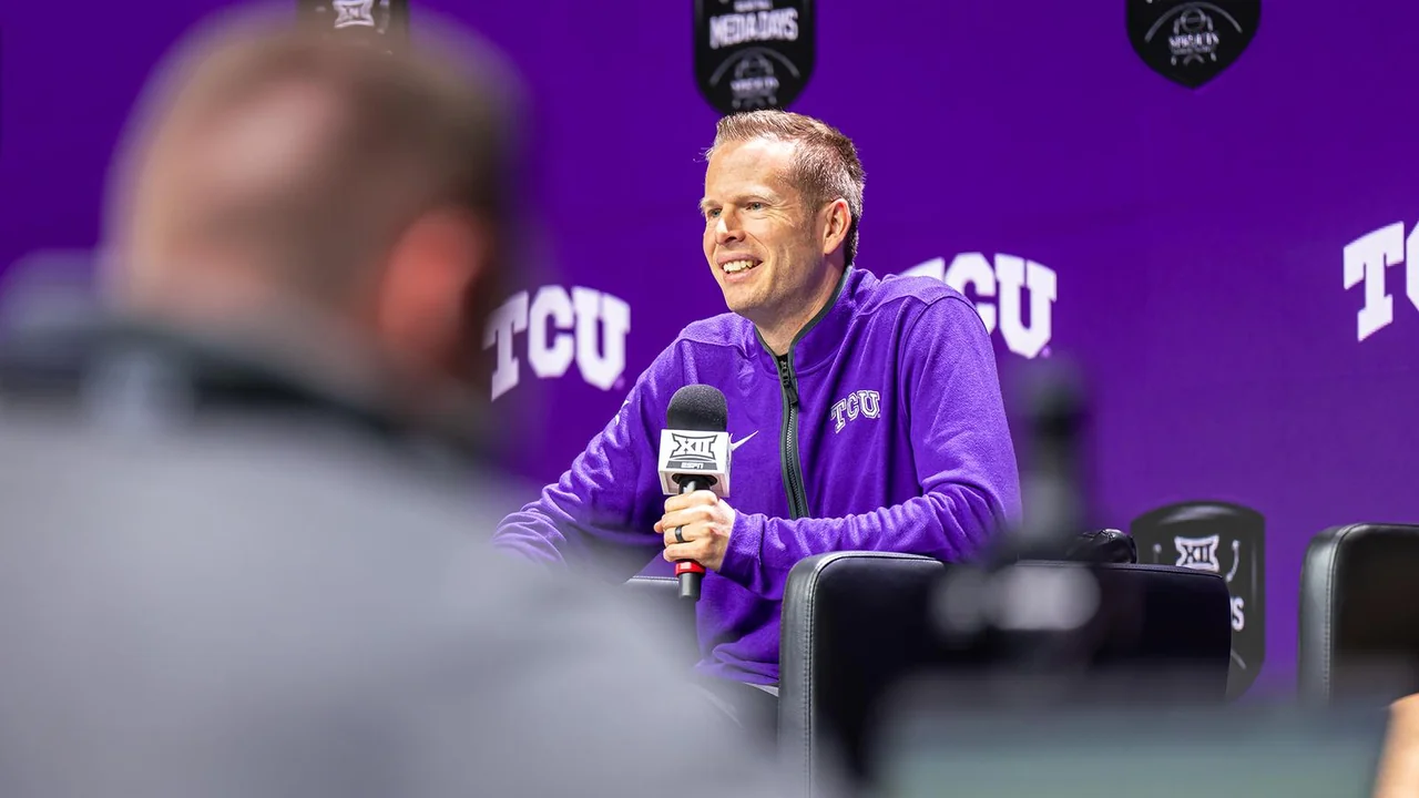TCU Horned Frogs women's basketball: coach smiling during a media interview
