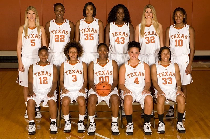 A second archival Texas Longhorns women's basketball team photo with players posing in orange and white uniforms