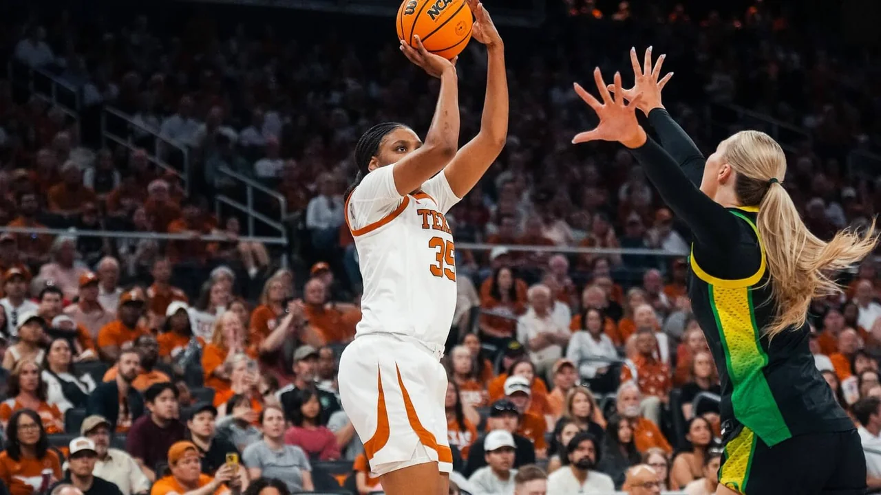 Texas Longhorns women's basketball: player taking a shot over a defender during a game