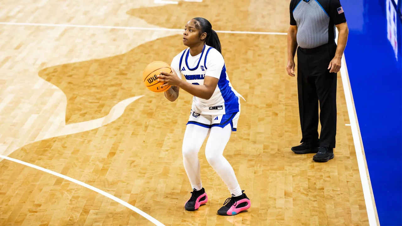 UNC Asheville Bulldogs women's basketball: player controlling the basketball on court