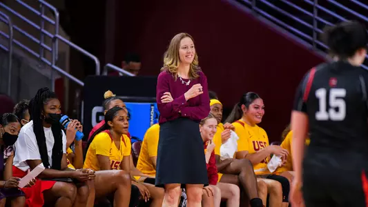 USC head coach Lindsay Gottlieb standing courtside watching her team during a game